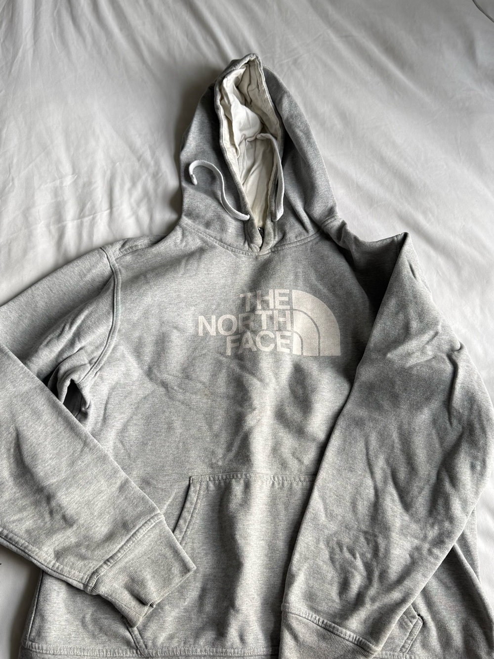 The North Face Light Gray Pullover Hoodie with Black Logo Tag